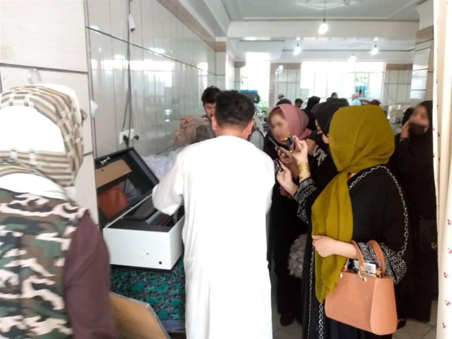 Women at an ARP tailoring workshop with sewing equipment